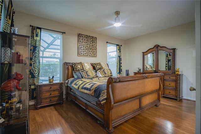 bedroom featuring hardwood / wood-style flooring and ceiling fan