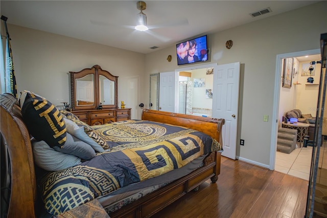 bedroom with ceiling fan and dark wood-type flooring