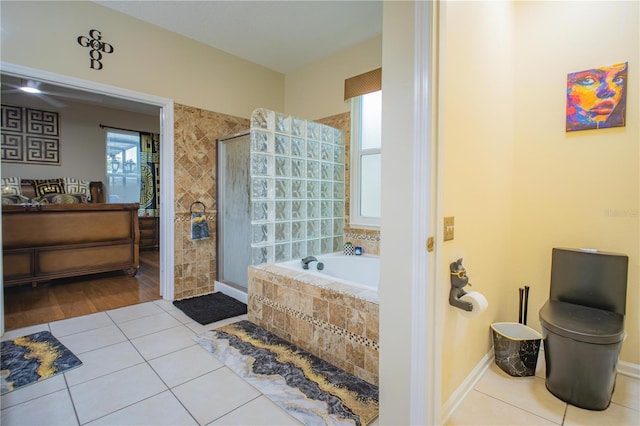 bathroom with plus walk in shower and tile patterned floors