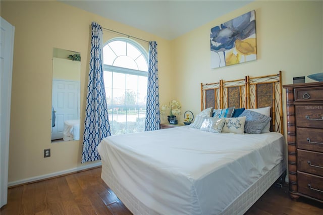 bedroom featuring dark wood-type flooring