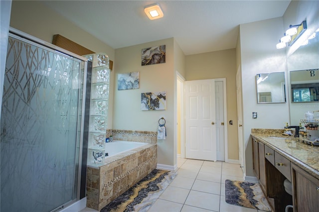 bathroom featuring tile patterned floors, separate shower and tub, and vanity