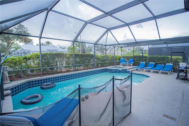 view of pool featuring a patio and glass enclosure