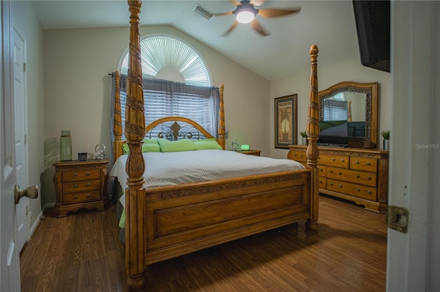 bedroom with ceiling fan, dark wood-type flooring, and vaulted ceiling