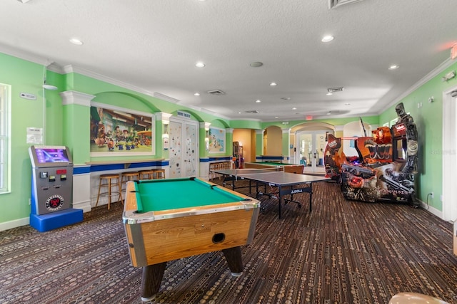 rec room with a textured ceiling, ornamental molding, and billiards