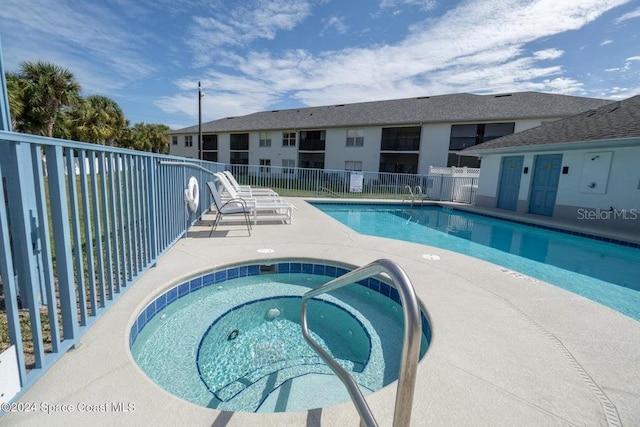 view of pool with a community hot tub