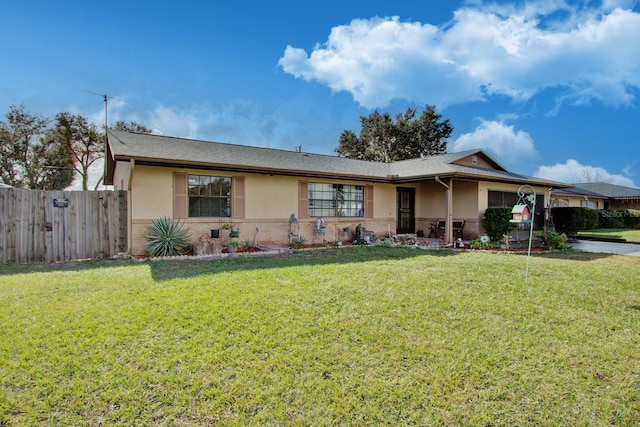 single story home with a front lawn