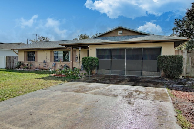 view of front of home featuring a garage and a front yard