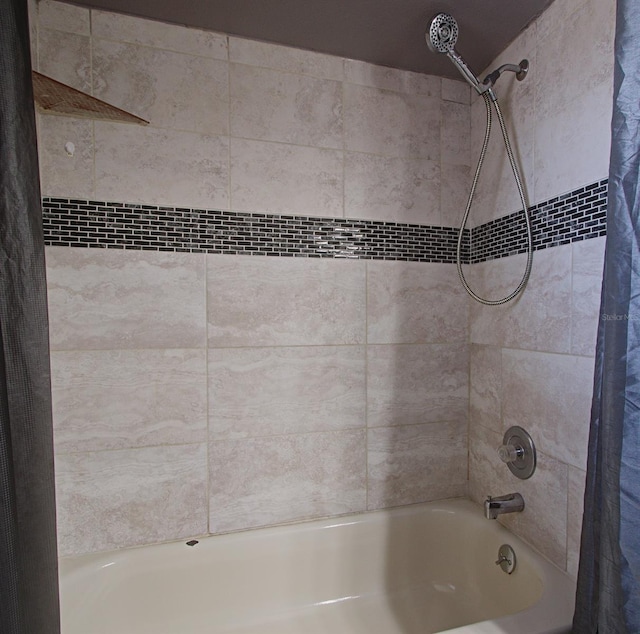 bathroom featuring shower / bath combo with shower curtain