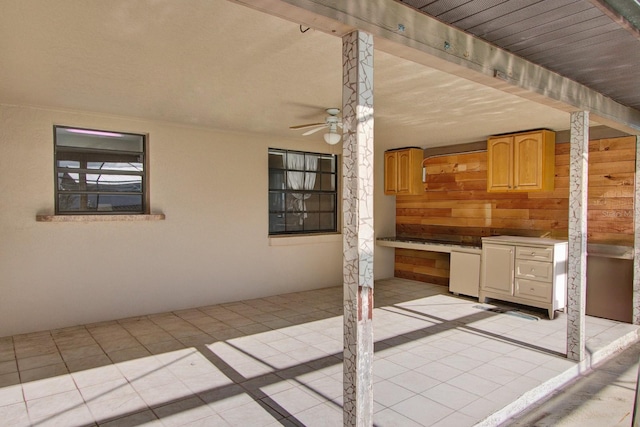 view of patio / terrace with ceiling fan and exterior kitchen