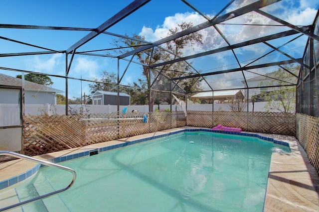 view of pool with glass enclosure