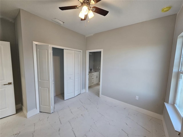 unfurnished bedroom with ceiling fan and a closet