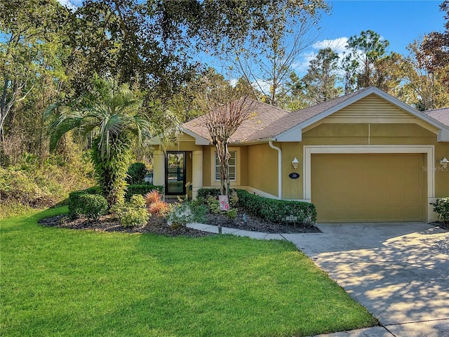 single story home with a garage and a front lawn