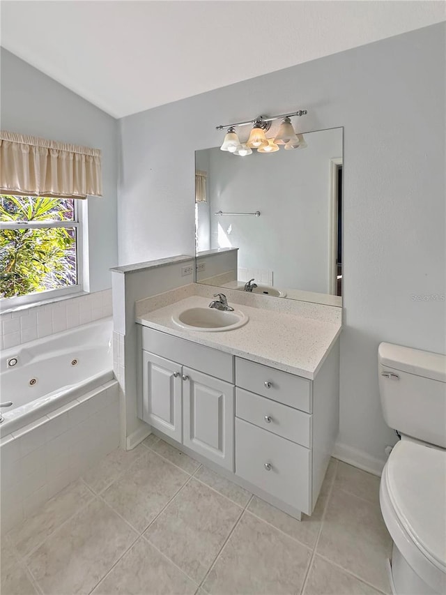 bathroom featuring vanity, tile patterned floors, vaulted ceiling, and toilet