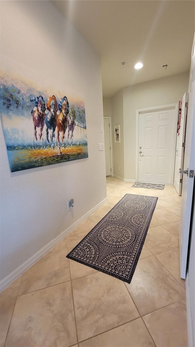 hall with light tile patterned flooring