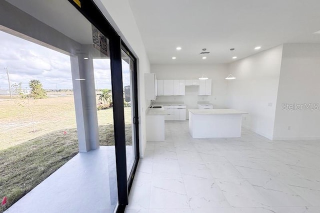 kitchen featuring white cabinetry and a kitchen island