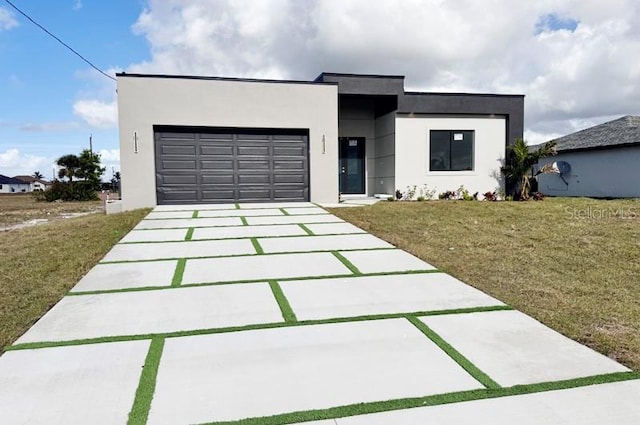 modern home with a front lawn and a garage