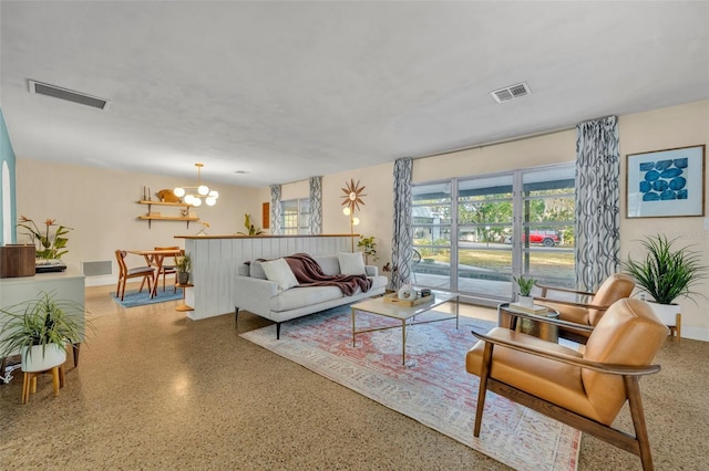 living room featuring a chandelier