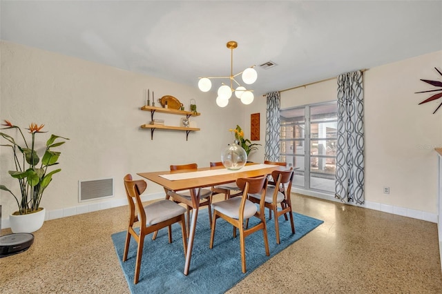 dining room featuring a notable chandelier