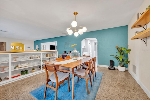 dining space with a chandelier