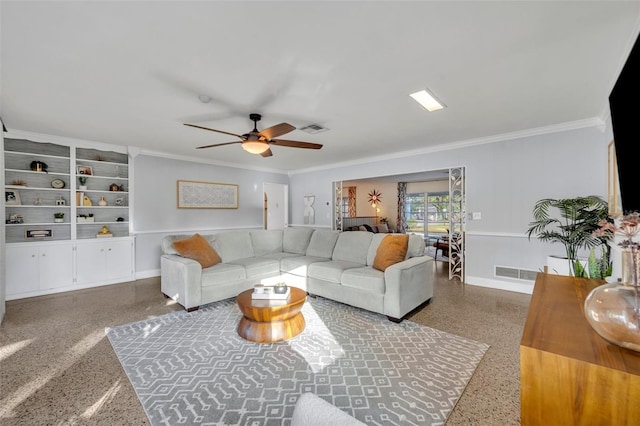 living room with ceiling fan, built in features, and crown molding