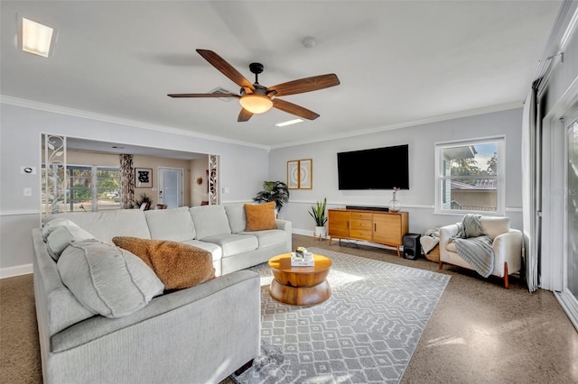 living room featuring ornamental molding and ceiling fan