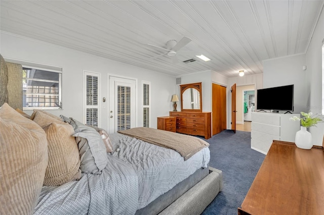 carpeted bedroom featuring ceiling fan and access to outside