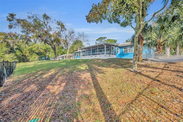 view of yard featuring a sunroom