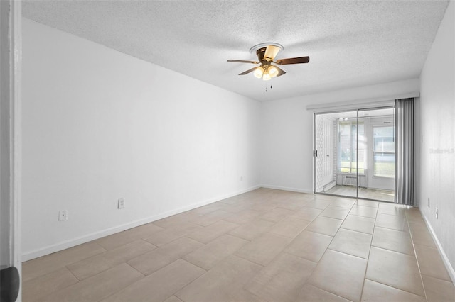 unfurnished room with light tile patterned floors, a textured ceiling, and ceiling fan