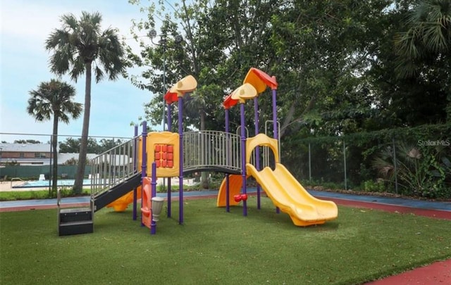 view of play area featuring a lawn