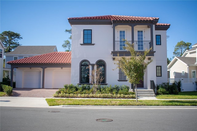 mediterranean / spanish-style home featuring a garage