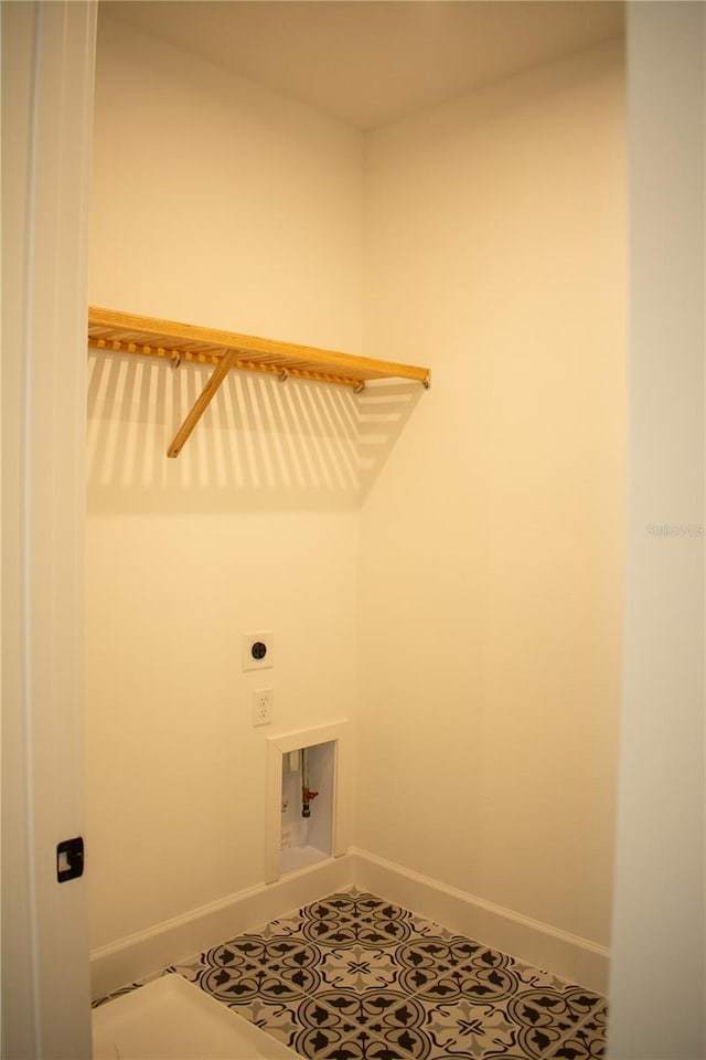 laundry room featuring hookup for a washing machine, tile patterned flooring, and hookup for an electric dryer