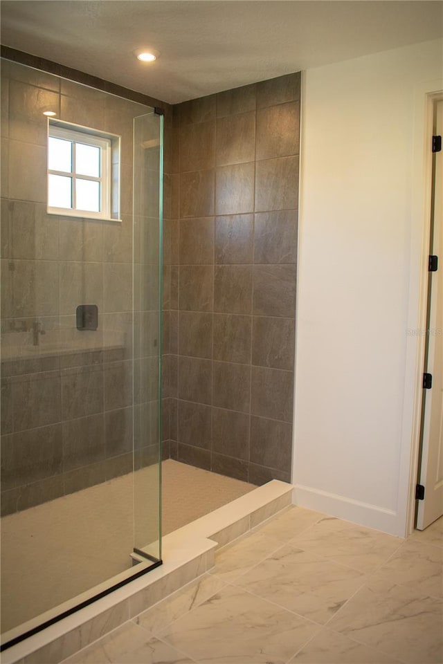 bathroom featuring a tile shower