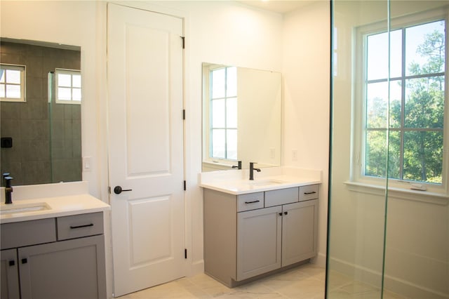 bathroom with vanity and a wealth of natural light