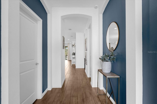 corridor with dark wood-type flooring