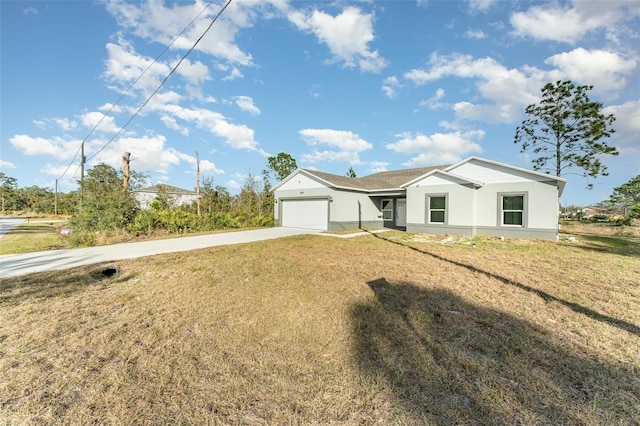 view of front facade with a front yard and a garage