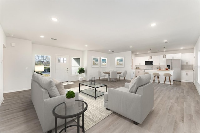 living room with light hardwood / wood-style floors