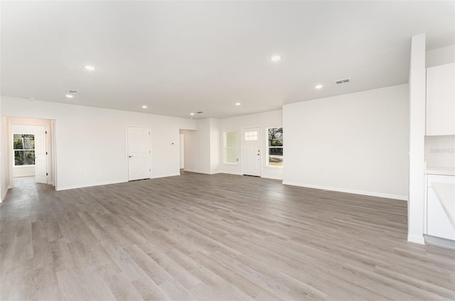 unfurnished living room featuring light hardwood / wood-style flooring