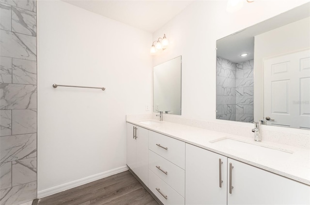 bathroom with vanity and wood-type flooring