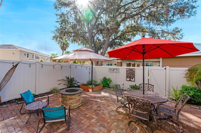 view of patio / terrace with a fire pit