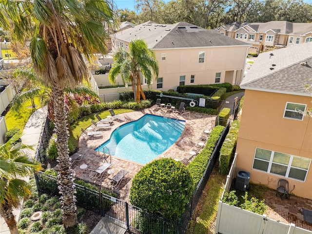 view of swimming pool with a patio area and cooling unit