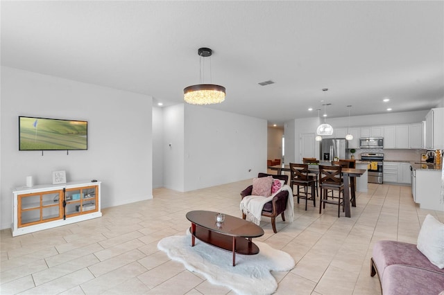 living room with light tile patterned floors