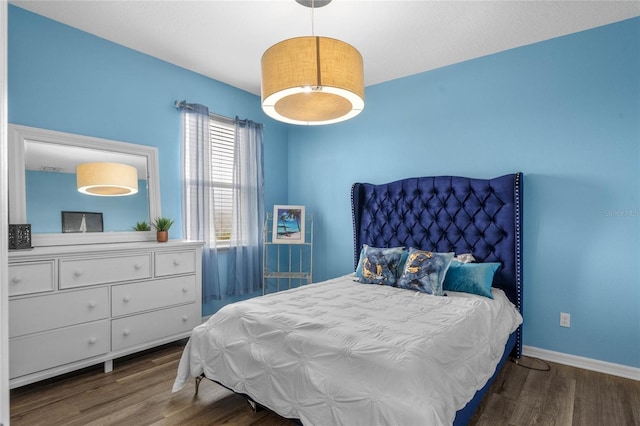 bedroom featuring dark hardwood / wood-style flooring