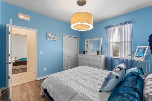 bedroom featuring a closet and wood-type flooring