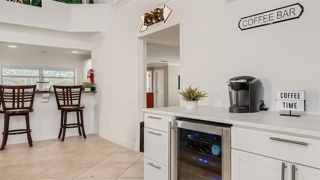 2377 Victoria Dr, Davenport, FL 33837 - bar with wine cooler, light tile patterned floors, and crown molding