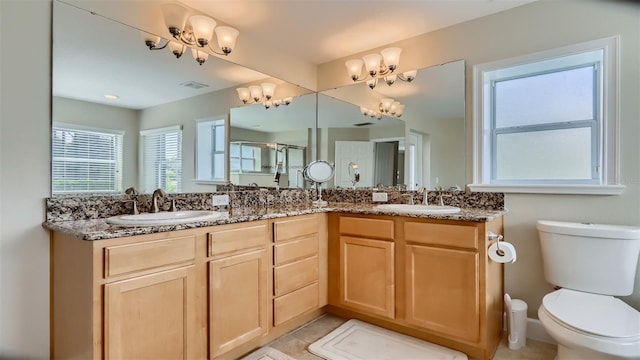 2377 Victoria Dr, Davenport, FL 33837 - full bath featuring double vanity, an enclosed shower, and a chandelier