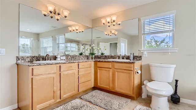 2377 Victoria Dr, Davenport, FL 33837 - full bathroom with a chandelier, double vanity, and a stall shower