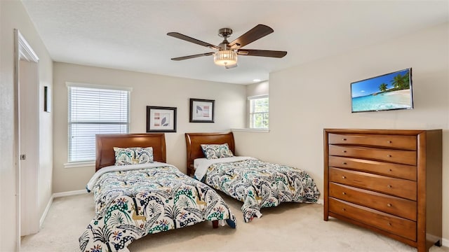 2377 Victoria Dr, Davenport, FL 33837 - bedroom featuring light colored carpet and a ceiling fan