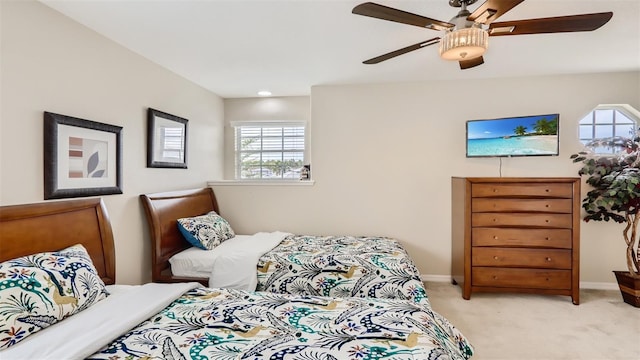 2377 Victoria Dr, Davenport, FL 33837 - bedroom with light colored carpet and a ceiling fan