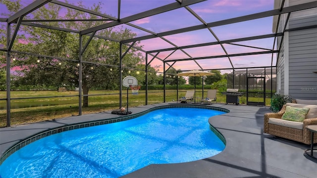 2377 Victoria Dr, Davenport, FL 33837 - swimming pool with a patio, glass enclosure, and area for grilling