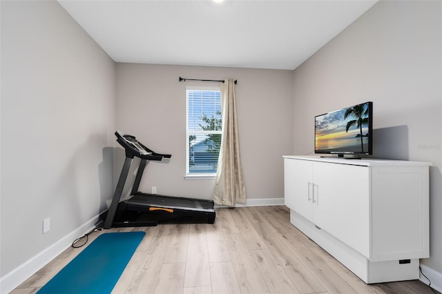 exercise area with light wood-type flooring